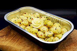 Gemarineerde aardappelpartjes met roomboter (400 gram)